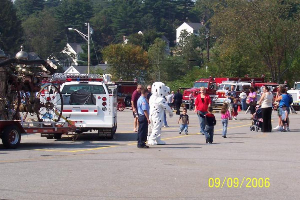 Fire Dalmatian Mascot Playing with Kids