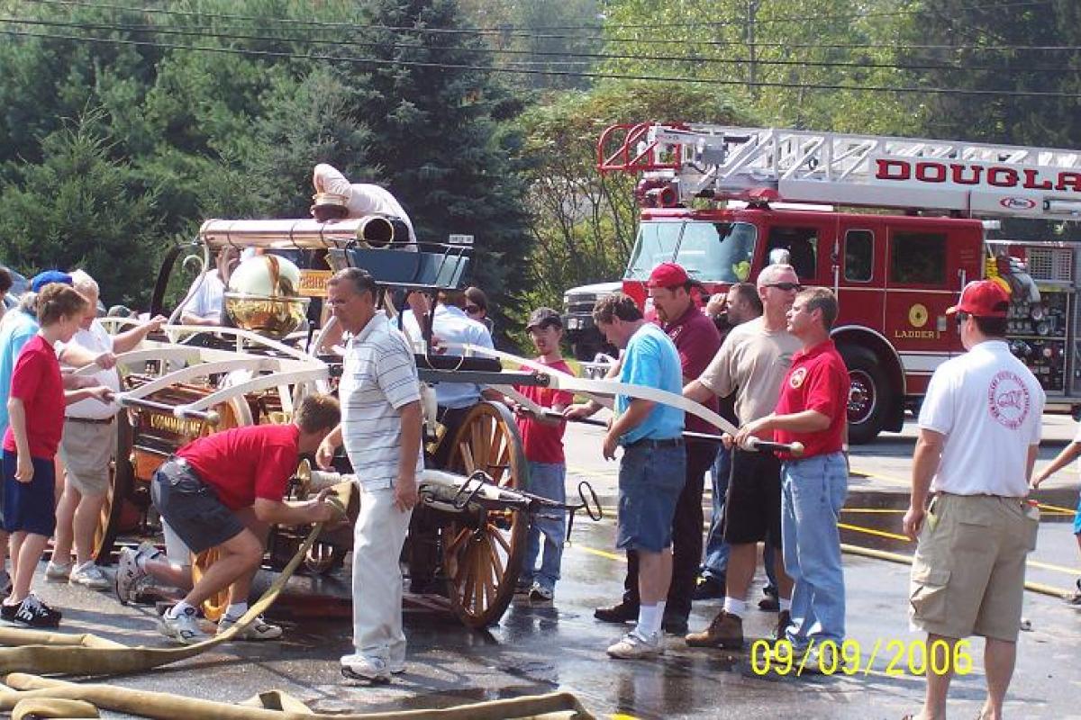 Citizens Checking out an Antique Fire Cart 1
