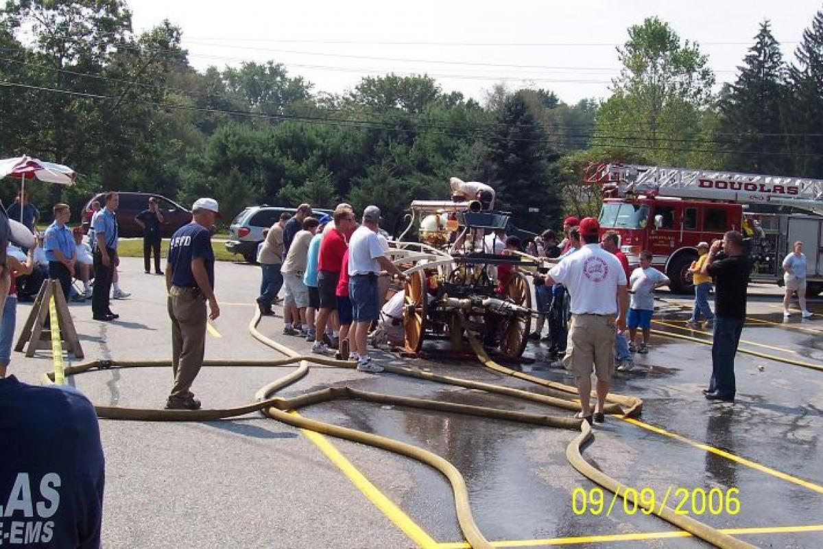 Citizens Checking out an Antique Fire Cart 2