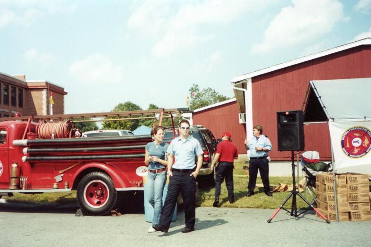 Two Firefighters Observe the Event