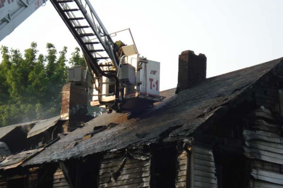 Fire Ladder Above the Roof of the Structure Fire